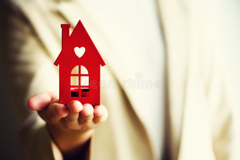 Female hand holding house key, real estate agent. Property insurance, security and cozy home concept. Copy space. Female hand holding house key, real estate agent. Property insurance, security and cozy home concept. Copy space.