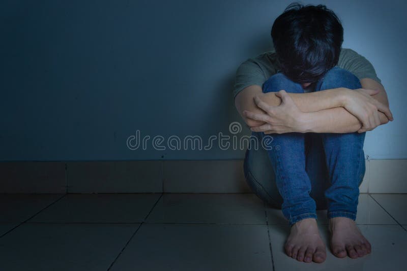 sad man hug his knee and cry sitting alone in a dark room. Depression, unhappy, stressed and anxiety disorder concept, abuse, abused, adult, background, bad, beautiful, black, boy, confusion, depressed, despair, desperate, displeased, emotion, emotional, expression, face, floor, frustration, grief, health, home, loneliness, lonely, male, men, mental, negative, pain, person, problem, problems, sadness, solitude, sorrow, teenager, tired, young. sad man hug his knee and cry sitting alone in a dark room. Depression, unhappy, stressed and anxiety disorder concept, abuse, abused, adult, background, bad, beautiful, black, boy, confusion, depressed, despair, desperate, displeased, emotion, emotional, expression, face, floor, frustration, grief, health, home, loneliness, lonely, male, men, mental, negative, pain, person, problem, problems, sadness, solitude, sorrow, teenager, tired, young