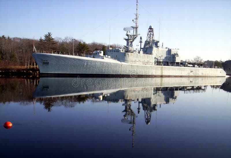 Warship reflection, old derelict warship The H M C S Fraser tied to wharf lahave river Bridgewater Lunenburg County Nova Scotia Canada. Warship reflection, old derelict warship The H M C S Fraser tied to wharf lahave river Bridgewater Lunenburg County Nova Scotia Canada