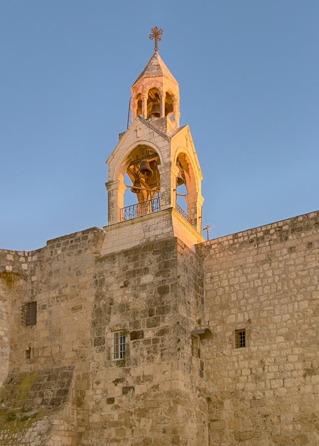 Holy Church Of The Nativity bell tower glows in the late afternoon sun, Bethlehem, Israel. The church marks the spot where Jesus was born (Luke 2:7). Holy Church Of The Nativity bell tower glows in the late afternoon sun, Bethlehem, Israel. The church marks the spot where Jesus was born (Luke 2:7).