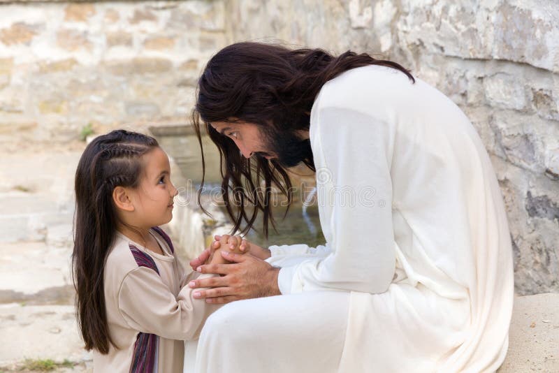 Biblical scene when Jesus says, let the little children come to me, blessing a little girl. Historical reenactment at an old water well. Biblical scene when Jesus says, let the little children come to me, blessing a little girl. Historical reenactment at an old water well.