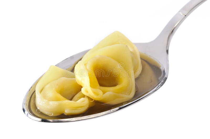 Ιταλικά ζυμαρικά, tortellini στο κουτάλι στοκ εικόνες με δικαίωμα ελεύθερης χρήσης Ιταλικά ζυμαρικά, tortellini στο κουτάλι στοκ εικόνες με δικαίωμα ελεύθερης χρήσης