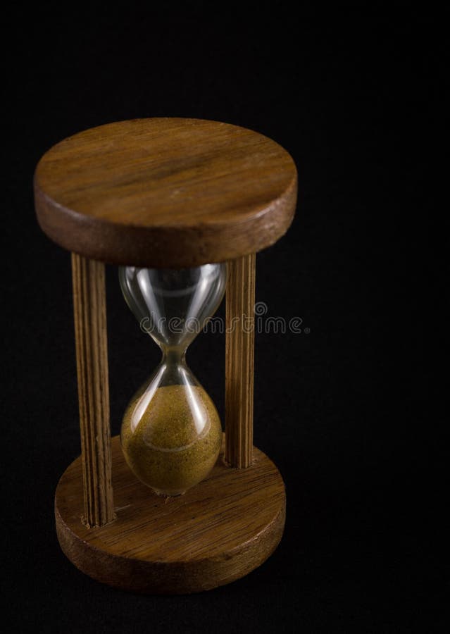 Hourglass on black background. Time is over. Hourglass on black background. Time is over.