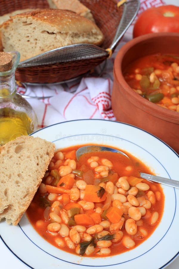 White bean soup, said by one authority to be the soup that feeds Greece, made with dried beans, tomato, carrot, celery, olive oil and onions. White bean soup, said by one authority to be the soup that feeds Greece, made with dried beans, tomato, carrot, celery, olive oil and onions.