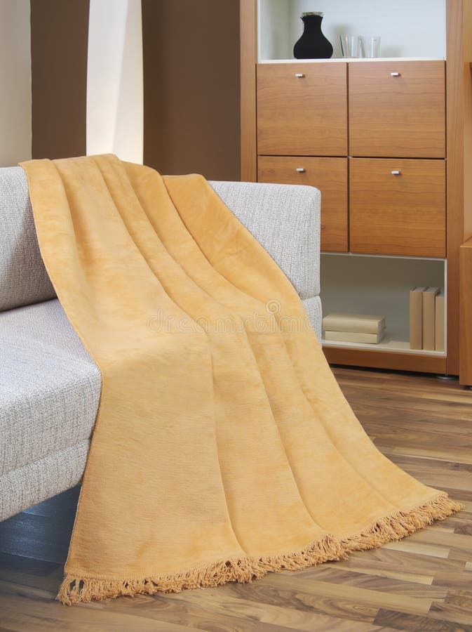 Blanket draped over a settee in the sitting room. Blanket draped over a settee in the sitting room