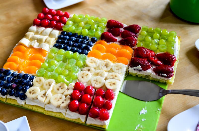 Colorful fruit sheet cake with cake server. Colorful fruit sheet cake with cake server