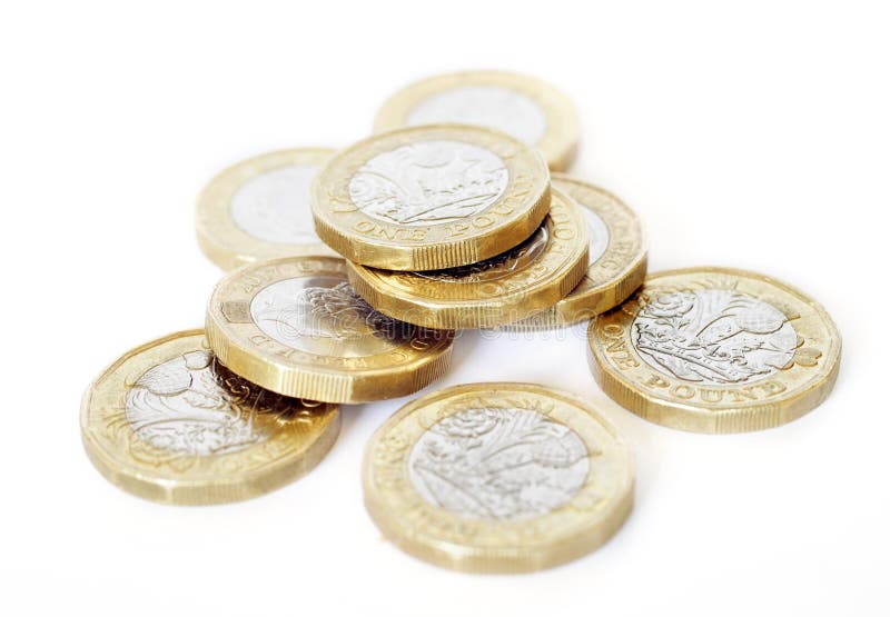 Quantity of latest type UK pound coins on a white background. Quantity of latest type UK pound coins on a white background