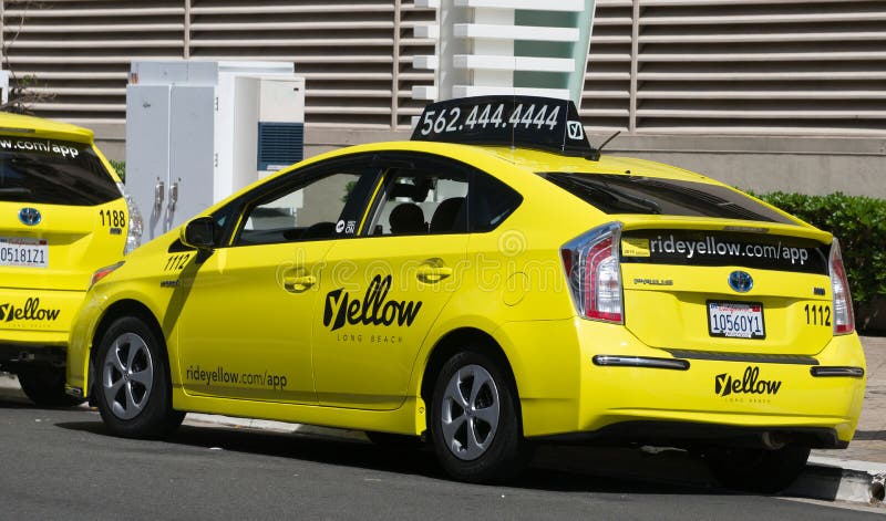LONG BEACH, CA/USA - MARCH 19, 2016: California Yellow Cab taxi exterior and logo. California Yellow Cab is a cab company in California. LONG BEACH, CA/USA - MARCH 19, 2016: California Yellow Cab taxi exterior and logo. California Yellow Cab is a cab company in California.