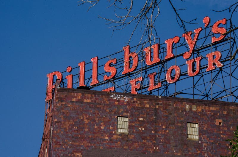 Pillsburyâ€™s Best Flour in Downtown Minneapolis in the Marcy Holmes neighborhood - sign against bright blue sky. Pillsburyâ€™s Best Flour in Downtown Minneapolis in the Marcy Holmes neighborhood - sign against bright blue sky