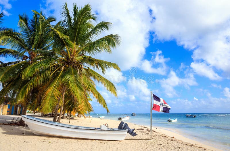 Beautiful caribbean beach and Dominican Republic flag. Beautiful caribbean beach and Dominican Republic flag