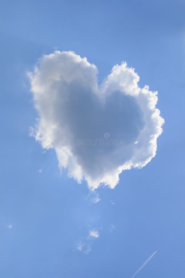 Naturally heart shaped cloud in a blue spring afternoon sky. Naturally heart shaped cloud in a blue spring afternoon sky.