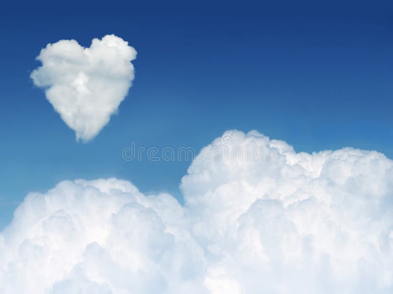 Cloud nine concept - a heart shaped cloud formation against clear blue sky, with space for copy. Cloud nine concept - a heart shaped cloud formation against clear blue sky, with space for copy.
