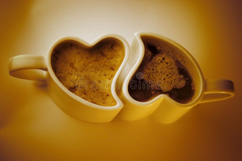 Two heart shaped cups of coffee. Two heart shaped cups of coffee