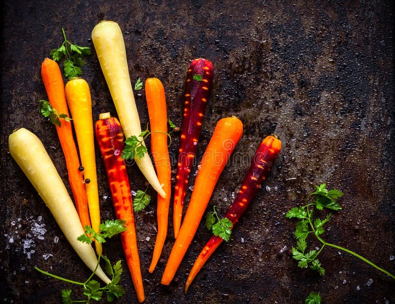 Raw rainbow carrot for roasting, on a baking tray. Raw rainbow carrot for roasting, on a baking tray