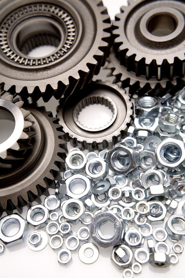 Gears and nuts closeup, studio shot. Gears and nuts closeup, studio shot