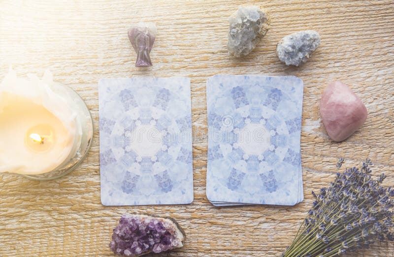 Deck with divination Angel cards on light wooden table, surrounded with semi precious stones crystals. Deck with divination Angel cards on light wooden table, surrounded with semi precious stones crystals.