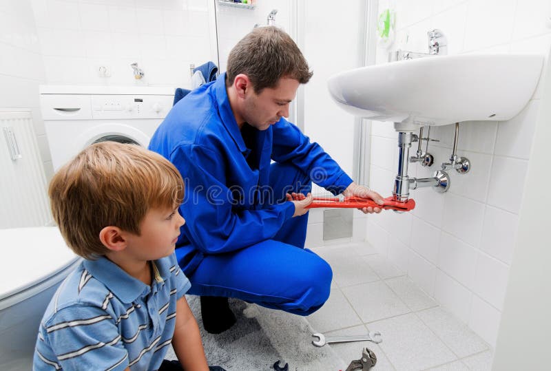 A plumbing repair a broken sink in bathroom. A plumbing repair a broken sink in bathroom