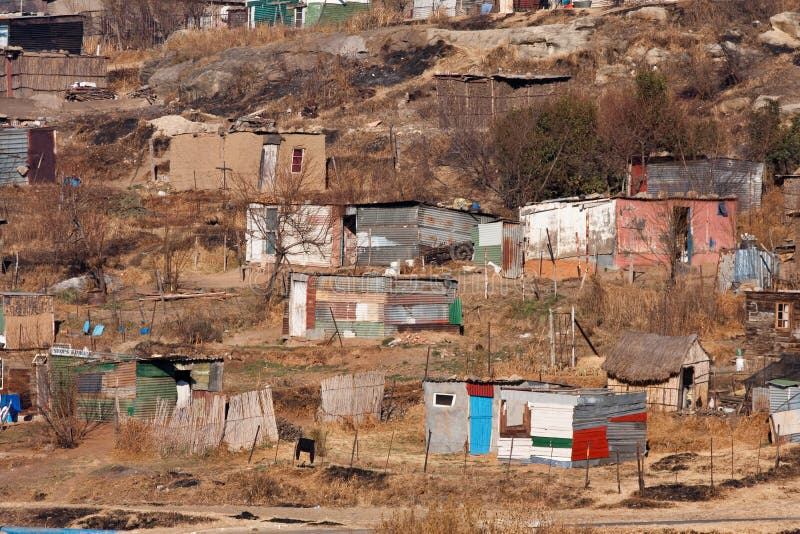 Poor squatter camp in africa with shacks in winter. Poor squatter camp in africa with shacks in winter