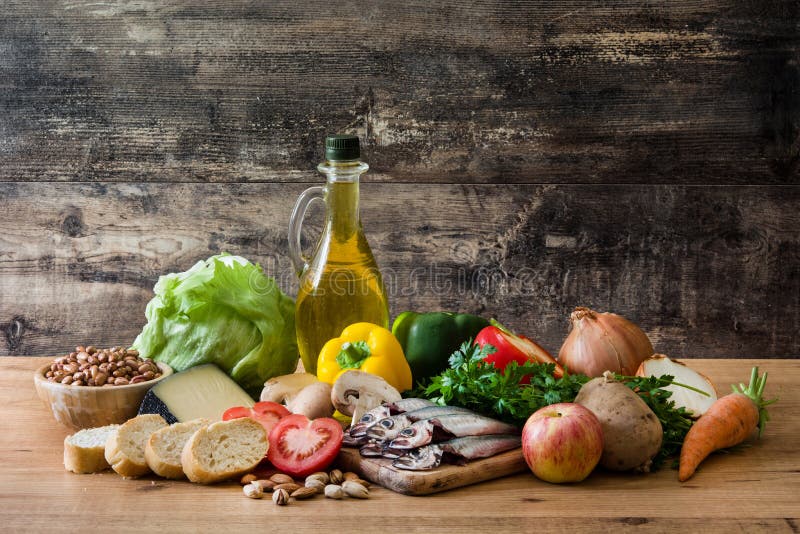 Healthy eating. Mediterranean diet. Fruit,vegetables, grain, nuts olive oil and fish on wooden table. Healthy eating. Mediterranean diet. Fruit,vegetables, grain, nuts olive oil and fish on wooden table