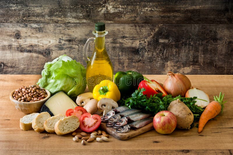 Healthy eating. Mediterranean diet. Fruit,vegetables, grain, nuts olive oil and fish on wooden table. Healthy eating. Mediterranean diet. Fruit,vegetables, grain, nuts olive oil and fish on wooden table