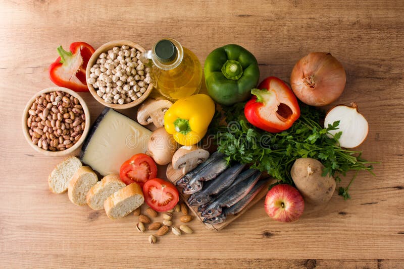 Healthy eating. Mediterranean diet. Fruit,vegetables, grain, nuts olive oil and fish on wooden table. Top view. Healthy eating. Mediterranean diet. Fruit,vegetables, grain, nuts olive oil and fish on wooden table. Top view