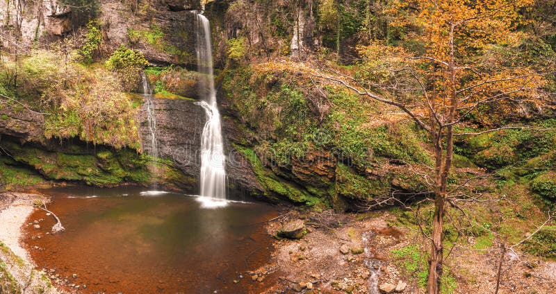 The waterfall of Ferrera in a natural rock amphitheater, Varese. The waterfall of Ferrera in a natural rock amphitheater, Varese