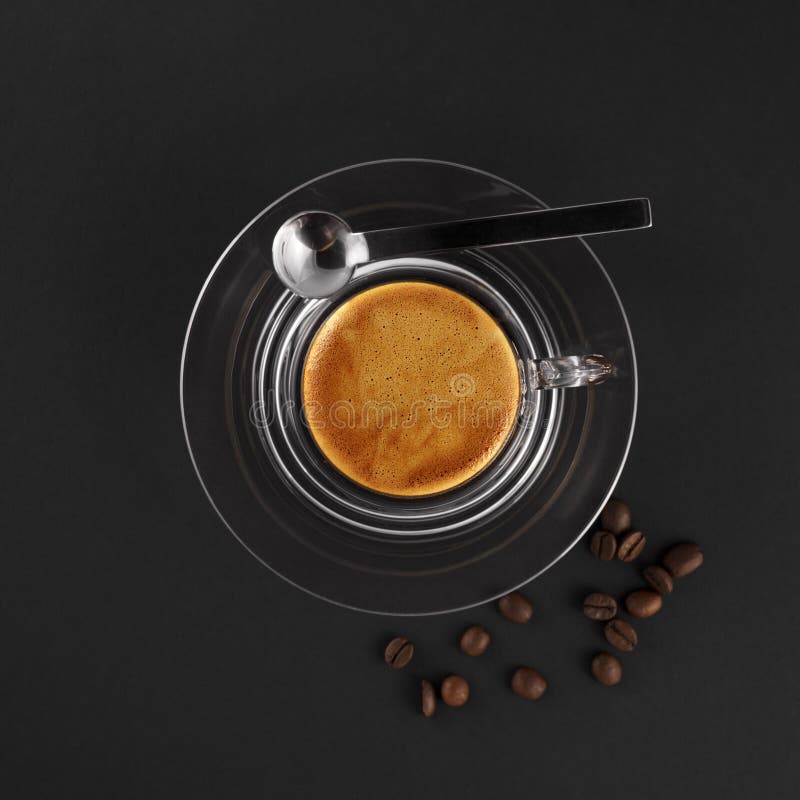 Glass coffee cup with fresh made espresso (black background). Glass coffee cup with fresh made espresso (black background)