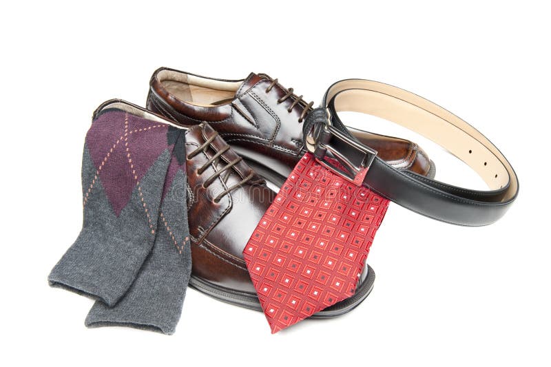 New brown leather shoes with red necktie and Argyle socks on white. New brown leather shoes with red necktie and Argyle socks on white