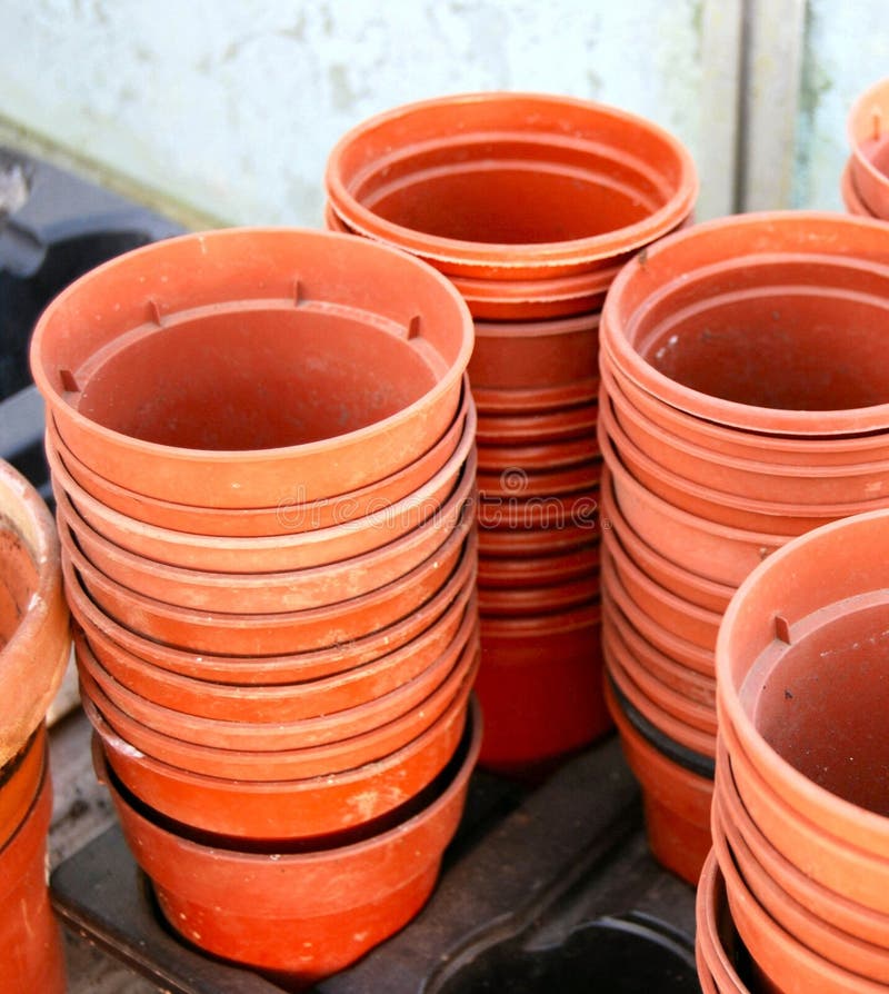 Several stacks of old empty plastic plant pots. Several stacks of old empty plastic plant pots