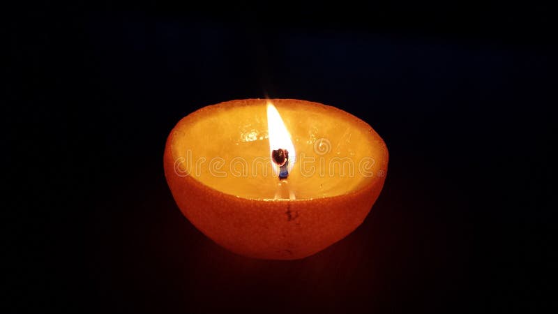 Candle made from an orange. Candle made from an orange.