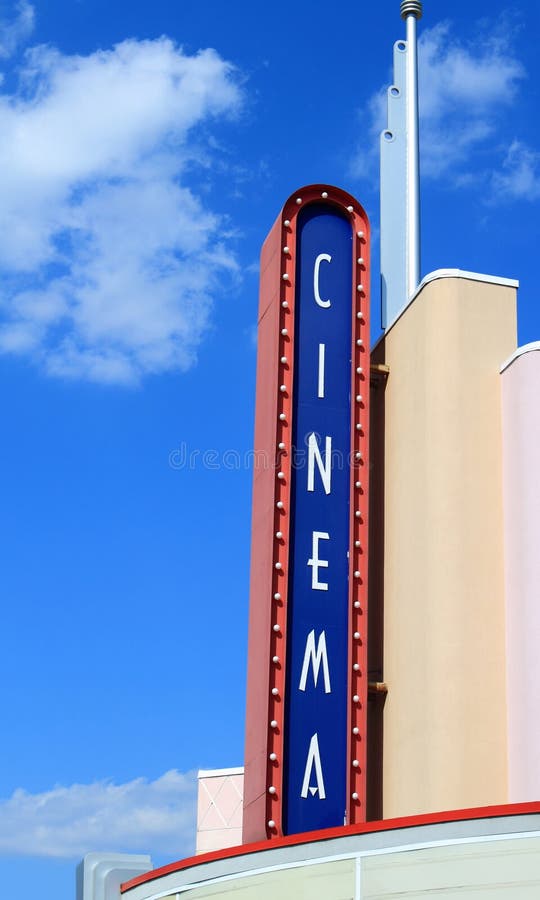 Movie theater sign on blue sky background. Movie theater sign on blue sky background