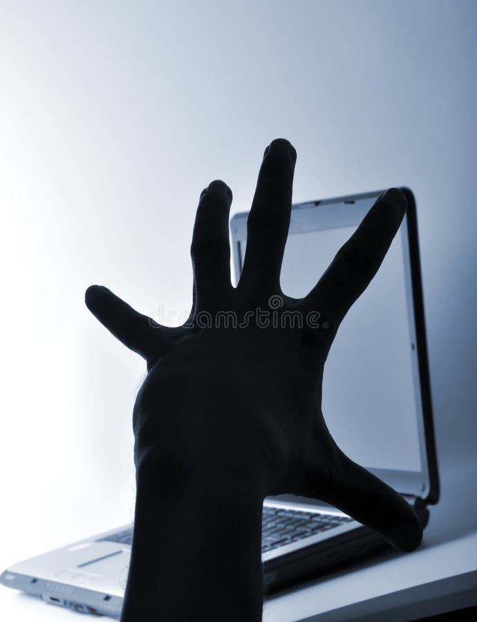 thief hand ready to hack the computer. thief hand ready to hack the computer