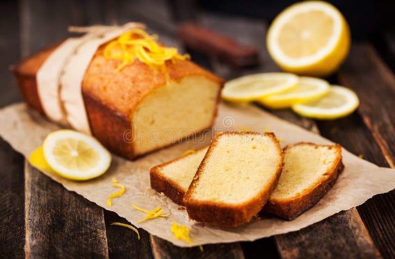 Homemade delicious classic lemon pound cake on rustic wooden table. Homemade delicious classic lemon pound cake on rustic wooden table