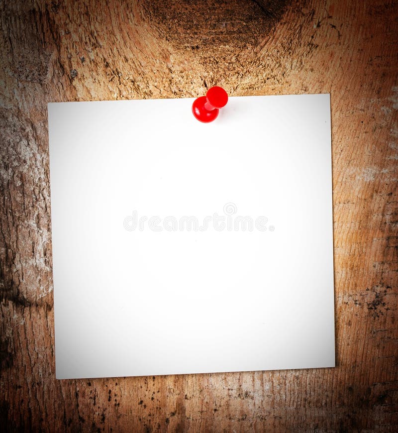 White Paper sheet reminder With red Push Pin on wooden old background. White Paper sheet reminder With red Push Pin on wooden old background