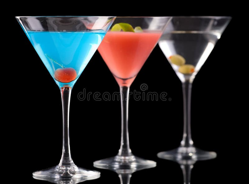 Art of cocktails. Betty Blue cocktail, Cosmopolitan cocktail and Dry Martini over black background. Art of cocktails. Betty Blue cocktail, Cosmopolitan cocktail and Dry Martini over black background.