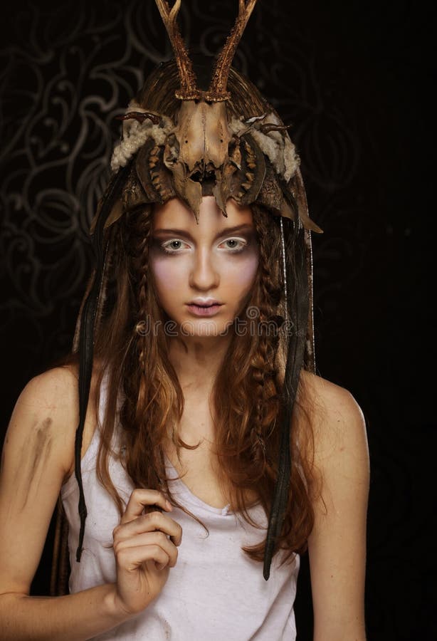 Stylish young woman with bright makeup, braided braids, party, carnival, halloween. Close up. Stylish young woman with bright makeup, braided braids, party, carnival, halloween. Close up.