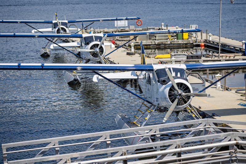 Close up of three Harbour Air seaplanes moored at floating terminal in Vancouver, British Columbia, Canada on 1 June 2023. Close up of three Harbour Air seaplanes moored at floating terminal in Vancouver, British Columbia, Canada on 1 June 2023