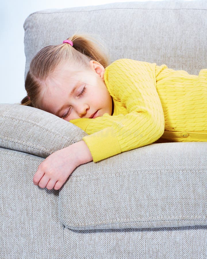 Sleeping girl on sofa. Tired child relax. Sleeping girl on sofa. Tired child relax.