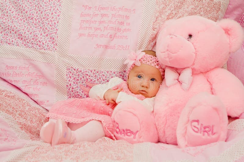 Baby girl on pink blanket with Bible verses. Baby girl on pink blanket with Bible verses