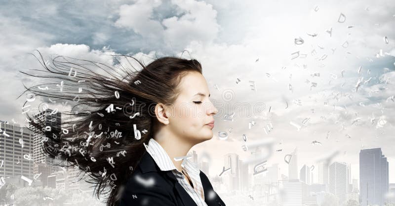 Young businesswoman with closed eyes and wind blowing in her face. Young businesswoman with closed eyes and wind blowing in her face