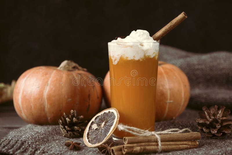 1 Cup pumpkin juice with cream and cinnamon, fresh whole pumpkins, cones, a slice of dried orange, autumn vegetable juice. 1 Cup pumpkin juice with cream and cinnamon, fresh whole pumpkins, cones, a slice of dried orange, autumn vegetable juice