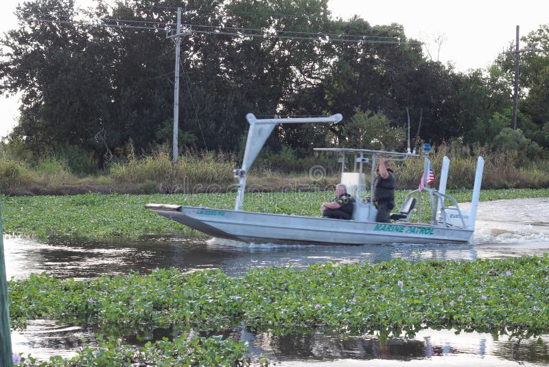 People on a boat on a South Louisiana bayou. People on a boat on a South Louisiana bayou.