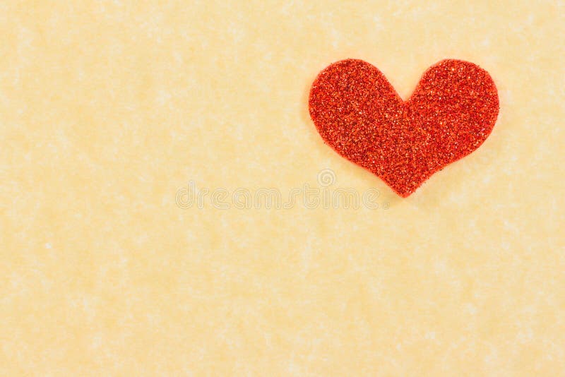 Red heart on vintage parchment paper background, love concept. Red heart on vintage parchment paper background, love concept