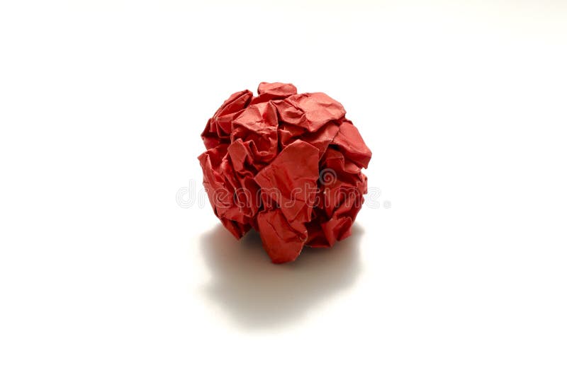 Red crumpled paper ball on a white background. Red crumpled paper ball on a white background