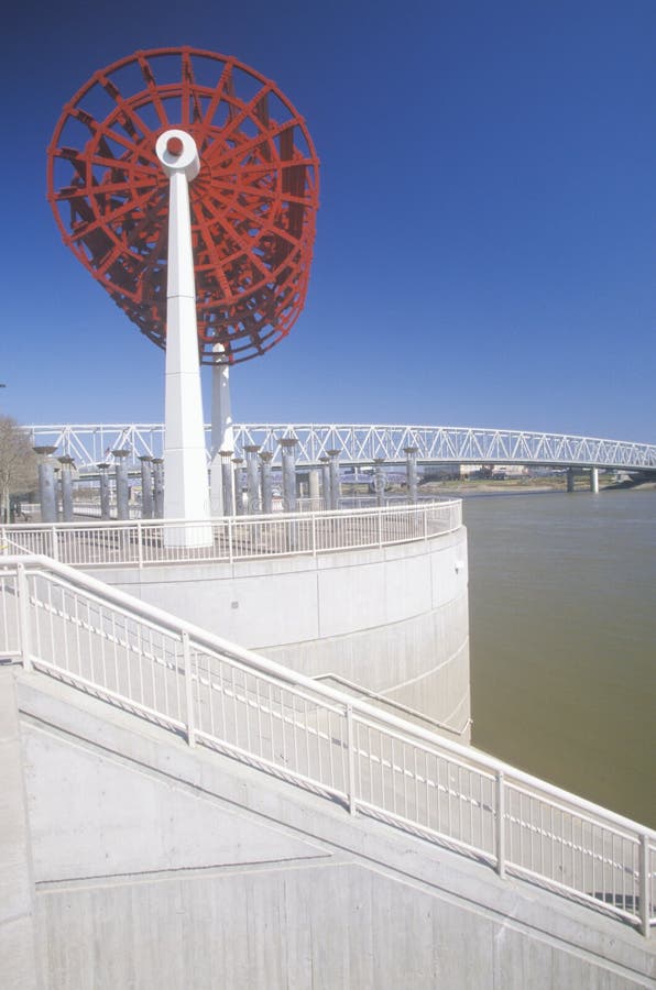 Red paddlewheel monument along Ohio River at Cincinnati, OH. Red paddlewheel monument along Ohio River at Cincinnati, OH