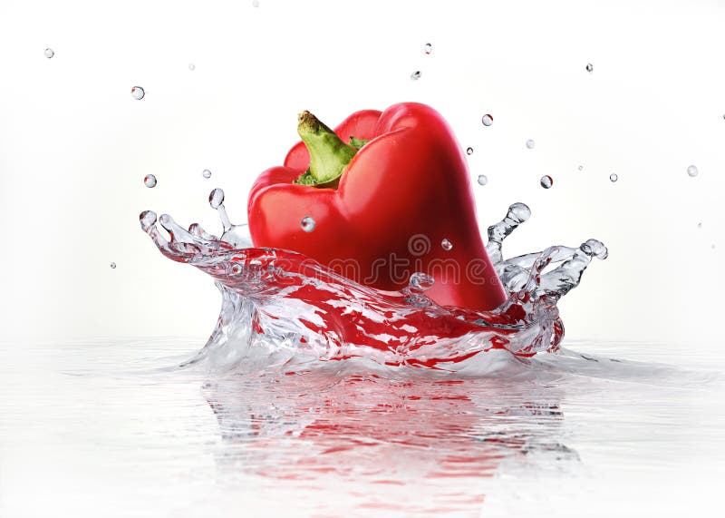 Red sweet bell pepper falling and splashing into clear water. Red sweet bell pepper falling and splashing into clear water.