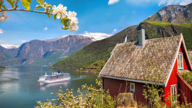 Red cottage against cruise ship in fjord, famous Flam, Norway. Red cottage against cruise ship in fjord, famous Flam, Norway