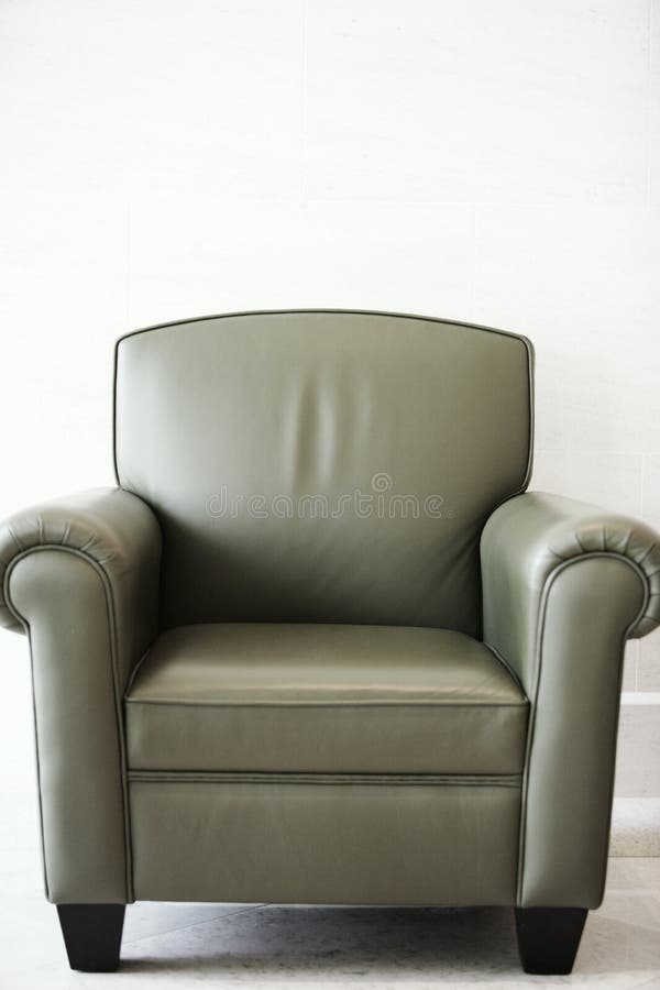 A dark leather lounge or club chair. A dark leather lounge or club chair