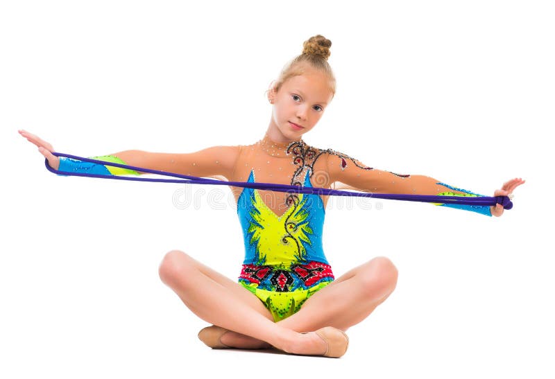 Λίγη gymnast συνεδρίαση στο πάτωμα με το πηδώντας σχοινί στοκ φωτογραφίες Λίγη gymnast συνεδρίαση στο πάτωμα με το πηδώντας σχοινί στοκ φωτογραφίες