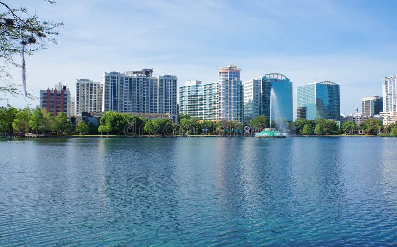 High-rise buildings, skyline, and fountain in Lake Eola at Downtown Orlando, Florida, United States, April 26, 2017. High-rise buildings, skyline, and fountain in Lake Eola at Downtown Orlando, Florida, United States, April 26, 2017